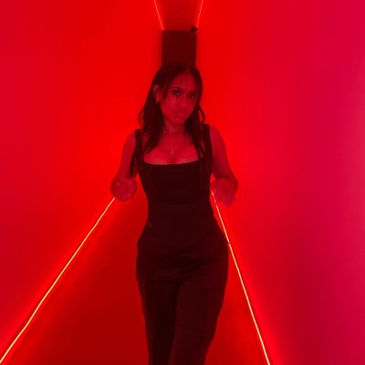 Nicolas Neruda Kodjoe's sister Sophie Kodjoe posed with the red lighting.